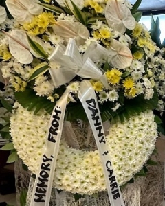 yellow and white round funeral standee